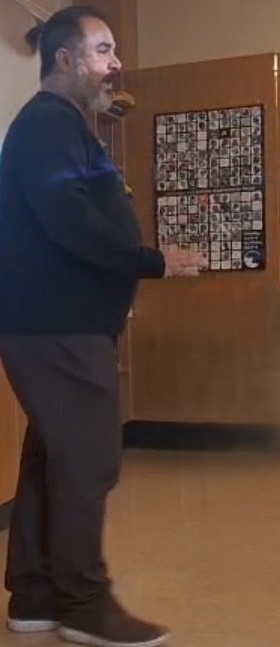 Dr. Miguel Ángel Avilés Galán teaching at the front of a classroom, speaking to students